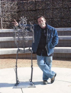 Gilbert McCann, with his Flower Child sculpture.